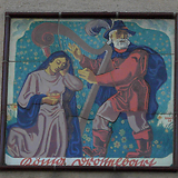 Spielmann und Königstochter aus dem Märchen Drosselbart. Keramiktafeln (bezeichnet „Krali 40“ [1940?]). Gemeindebau ‚Mithlingerhof-Rasenstadt‘, Neilreichgasse 104, Wien X